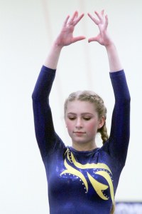 Anna Jacobi goes through her beam routine during this week’s meet against Holy Names Academy and Nathan Hale.