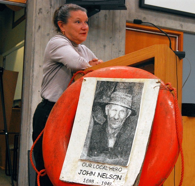 Jan Lund Buchanan of the John Nelson family shares Nelson's story with city council at Wednesday's meeting. City council approved the resolution to rename Strawberry Plant Park in honor of Nelson.