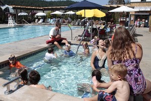 Some young swimmers enjoy a few minutes in the hot tub during adult swim — the last 10 minutes of every hour — at The Pool At Pleasant Beach.
