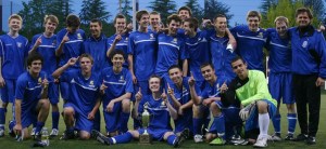 The Bainbridge boys' soccer team pose with the Metro League trophy after defeating Lakeside 1-0 in the championship game Friday night at Interbay Stadium in Seattle.