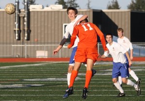 Bainbridge sophomore forward Sebastian Scales heads the ball over Decatur defender Alex Dedaj during the first half of Bainbridge's 7-0 win over the Gators in a opening round game of the 3A state tournament.
