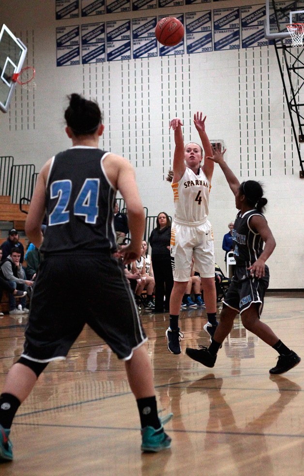 Taylor Tye shoots yet another big three-pointer in Wednesday night's game against Chief Sealth. The Spartans started slow