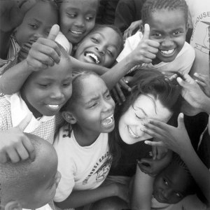 Galen Douglas of Project HAND UP gets a group hug from Kenyan school children.