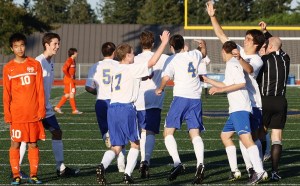 The Bainbridge boys’ soccer team celebrates Brad Olson’s first goal during its 7-0 win over Decatur in a 3A state tournament game Tuesday night at Memorial Stadium.
