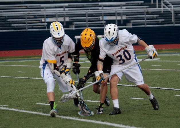 Max Wickline and Zach Morales struggle to regain ball control during Friday's home game against Bishop Blanchet.