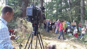 A television camera crew sets up to shoot protesters gathered at the Visconsi site Tuesday. A demonstration against a proposed shopping center planned for the land continued this week.
