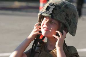 A youngster tries on a helmet during National Night Out on Bainbridge. The Bainbridge Island Police Department will host the event at city hall’s Town Square