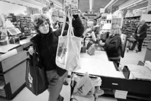 Town and Country shopper Jennifer Hagar loads up her cloth bags Tuesday morning at the market. The grocery store sells cloth bags available for shoppers to use while in the store.
