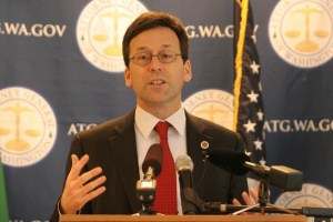 Washington State Attorney General Bob Ferguson announces criminal charges against the owner of a tugboat that sank in Eagle Harbor last October during a press conference in Seattle.