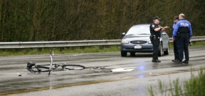 A bicycle and chunks of helmet mark the scene of a hit and run collision on State Route 305 Tuesday afternoon.