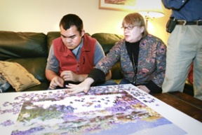 George Cruz (left) and Lorraine Ekholm in the living room.
