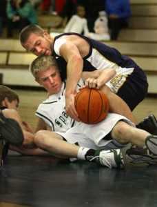 Mike Walsh battles for the ball with a Skyline player. Bainbridge lost to Skyline 69-50 in a 3A Sea-King District 2 game