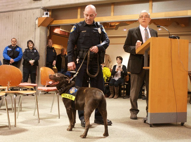 Rusty stands with his partner