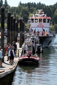 A celebration of all things seaworthy.  Crowds of island visitors and residents alike at Eagle Harbor Waterfront Park during last year’s Boater’s Fair
