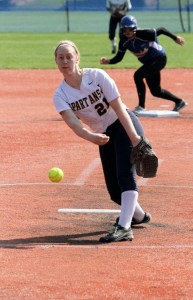 Alison Reichert fires in a pitch as the Spartan pitcher tries to keep the Golden Eagles from scoring again late in Bainbridge’s first game at state.