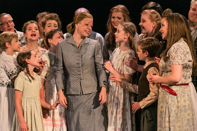 Michelle Lorenz Odell as Eva “Evita” Peron with the children’s chorus in Ovation! Musical Theatre Bainbridge’s production of Evita