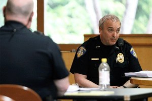 Bainbridge Island Police Chief Matthew Hamner answers questions during the Public Employment Relations Commission hearing at city hall.