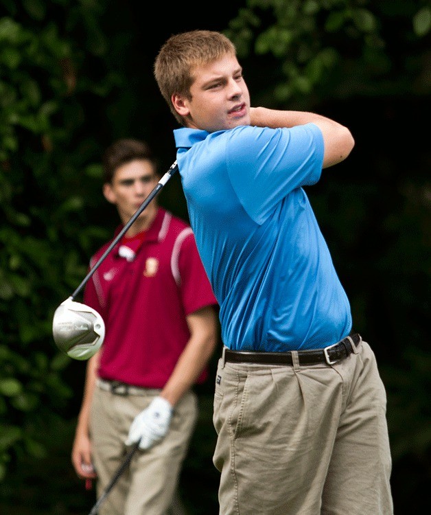BHS golfer Matthew Spence tees off against the visiting team from O’Dea last week. The Spartans won and remained undefeated.