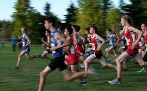 Dozens of runners of various boys cross country teams from schools around the area begin the 5K course at Battle Point Park during a meet hosted by the Bainbridge Spartans this week.