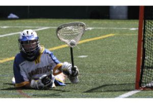 Bainbridge goalkeeper Bryce Stevenson makes a diving save during the WHSBLA Division I state championship game Saturday at Memorial Stadium at Seattle Center. He had nine saves.
