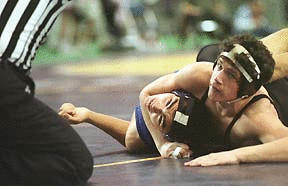 Jacob Hayashi (left) looks for the ref’s decision against Billy Weisgerber.