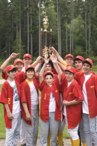 Les Schwab celebrates their 1-0 BI Babe Ruth title win over Windemere. First row: Alex Raquer