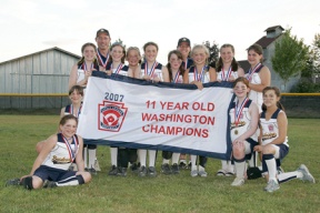 The Bainbridge Little League 10- and 11-year-old All-Stars pose with their banner after defeating Steel Lake 12-11 Thursday night to win their first ever state title. (Seated/kneeling