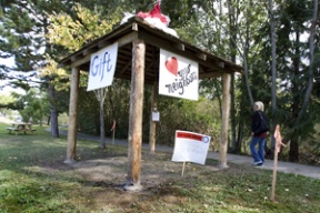 A newly refurbished gazebo on Ericksen Avenue comes replete with several signs