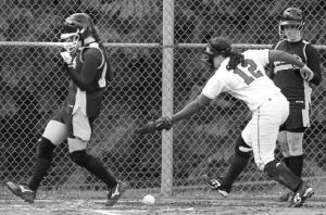 (Top) Cara Thompson gets past the tag of Prep’s Jessica Bladow as Brittany Wisner (right) looks on from the on-deck circle.