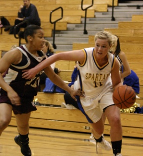 Spartan Allie Picha drives past Holy Names’ Devin Brooks.