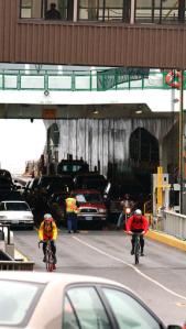 Bicyclists and cars join pedestrians in the Olympic Drive tangle.