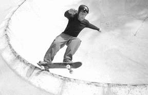 Brendan Corrao of Port Angeles frontside grinds the 8-foot bowl at the new Rotary Skate Bowl Saturday morning.