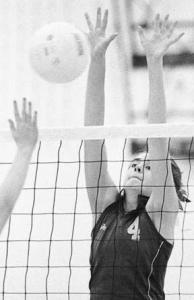 Laura Bartunek elevates to make a block against Nathan Hale Wednesday night.