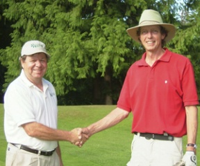 David Reeves (left) and Jay Wiggs shake hands after their record-breaking feat last Tuesday.