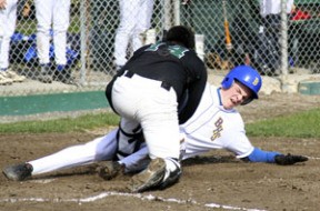 The Spartans’ Nick Brown gets tagged out by North Kitsap.