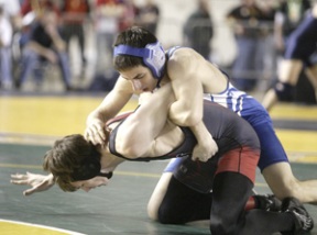 Peter Paskell fights for a takedown against Josh Barnert of Yelm Friday night. The senior went two and out at Mat Classic XIX.