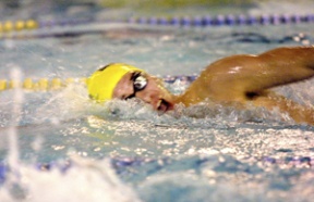 Austin Hallett competes in the 100 freestyle.