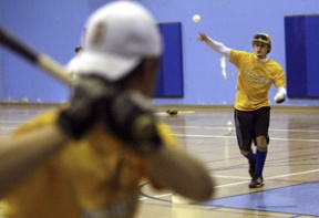 Senior shortstop Matt Frazee pitches to senior third baseman Brendan Gent in the Commodore gym. Frazee led the team in nearly every offensive category last year