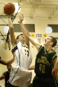 Bainbridge guard Rudy Sharar goes up for the score against Bishop Blanchet Tuesday night. The Spartans beat the Braves 48-37.