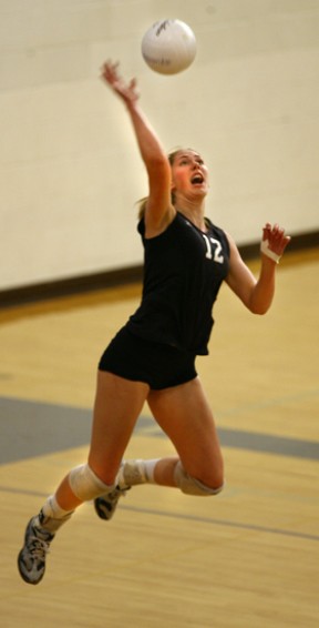 Hannah Stuart serves one up during the Bainbridge-Seattle Prep volleyball game Friday night. The Spartans swept the Panthers.