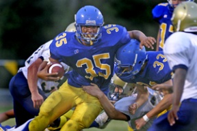 Running back Dayton Gilbreath works his way past the Bremerton defense and teammate Ross Cobb. Gilbreath finished with nine carries for 102 yards