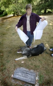 Jan Feise looks at a map of Hill Crest Cemetery. She has owned the property for 30 years