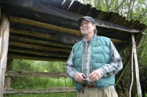 Gale Cool stands under a shelter at Meigs Farm