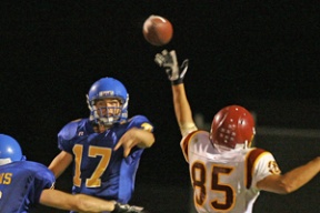 Quarterback Quinton Agosta tosses a pass just over the outstretched hand of O’Dea defensive end Ben Haves. The senior was 9 of 21 for 78 yards and a touchdown. He also ran for a score.