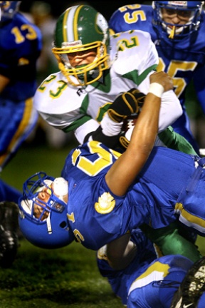 Spartan linebacker James Herman takes down Brave running back Cameron Cutter during first quarter action Thursday at BHS.