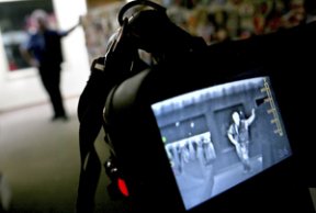 Acting Fire Chief Glen Tyrrell demonstrates one of three new thermal imaging devices by pointing it at a fellow firefighter.