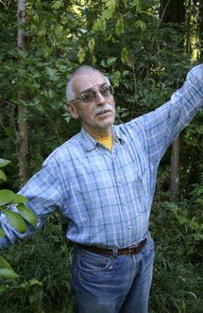 Paulanna Lane resident Jean-Paul Gagnon bemoans city regulations at the site of his condemned organic garden.
