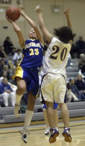(From top) The Spartan bench cheers on their teammates;  Angela Failla drives to the hoop Saturday as Viking senior Jessie Eadie tries to block the shot.