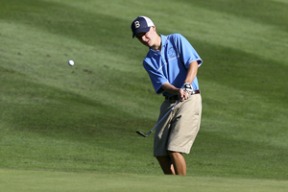 Jamie Neill chips one onto the green Tuesday at Wing Point in a match against Mercer Island. The senior captain shot a 78.