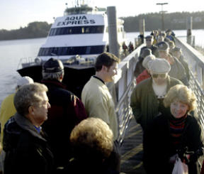 Commuters debark the Aqua Express ferry on the new Kingston-Colman Dock run.